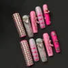 Bling Punk Press-On Nails with pink chrome base and metallic studs