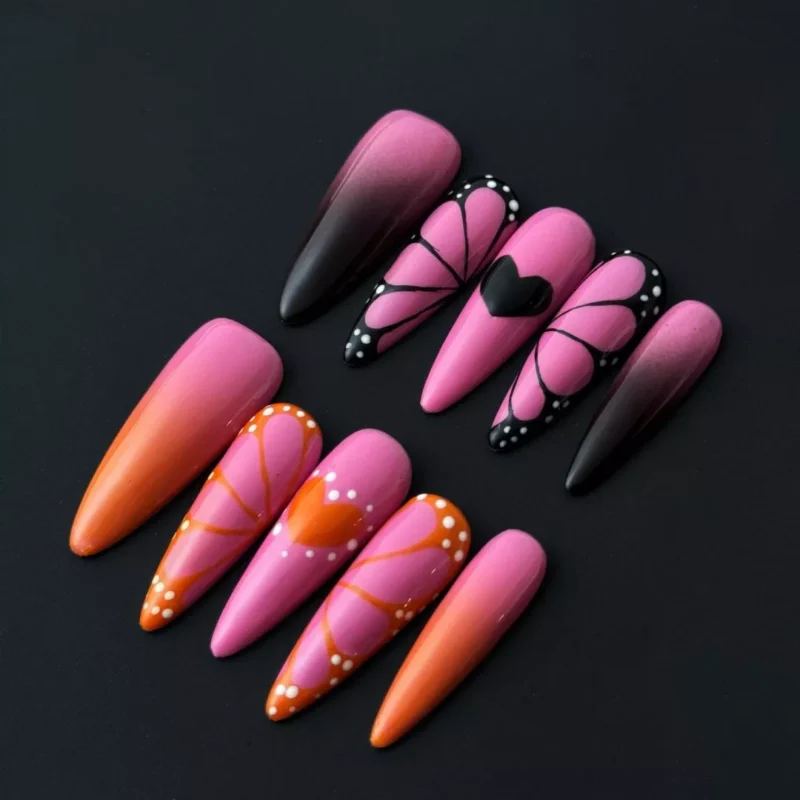 Pink Ombre Press-On Nails with butterfly accents and stiletto shape