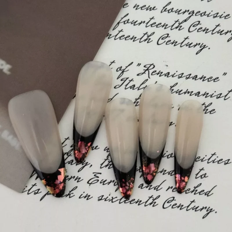 Close-up of foil tip on nude base French press-on nails