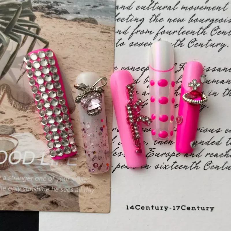 Punk-inspired press-on nails with crystal letters and silver accents
