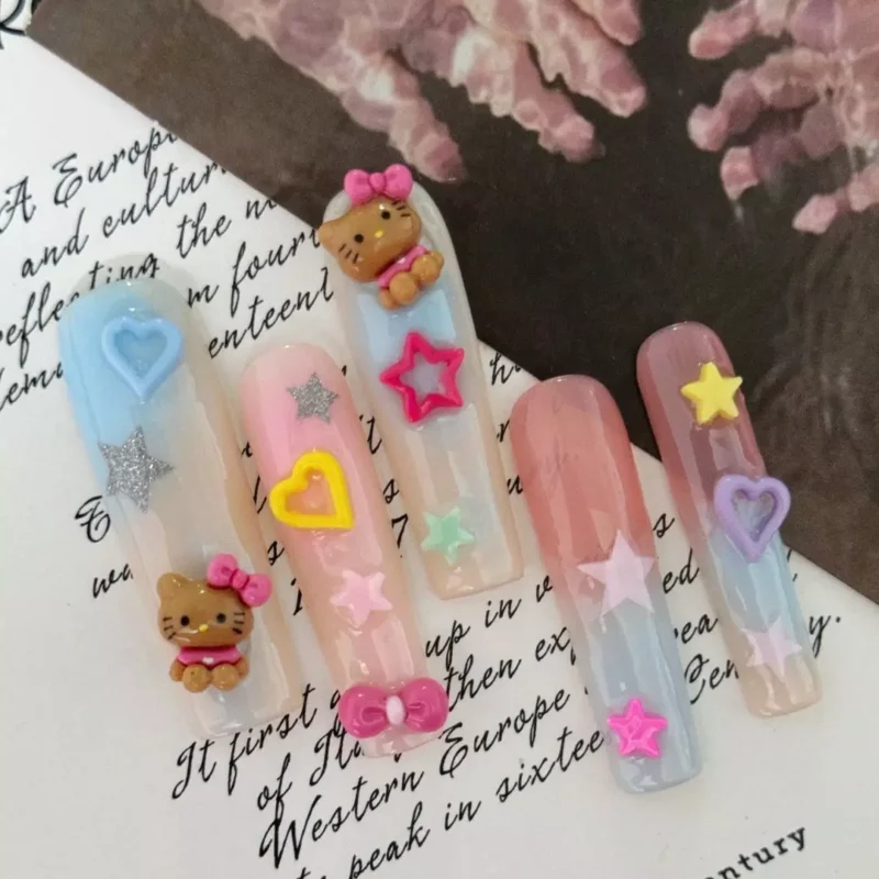 Pastel Rainbow Press-On Nails Featuring Cartoon Stars and Bows