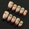 Rhinestone Cherry Press-On Nails - Nude Base with Dark Red V-Tips 5 Close-up of Rhinestone Cherry Press-On Nails with nude base and dark red V-tips featuring cherry gem design