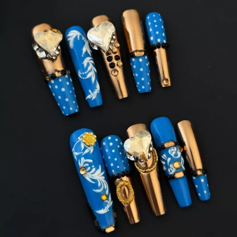 Royal Blue Press-On Nails with gold accents and heart crystal charms - full hand view