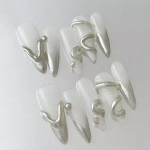 Silver coffin-shaped press-on nails featuring chrome drip accents