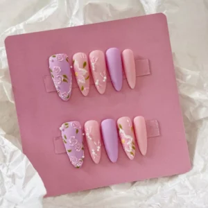 Pastel matte press-on nails with intricate flower sculpting and pearl tips – side view