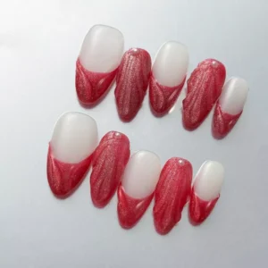 Matte red almond nails with pearl sculpted accents in elegant French style