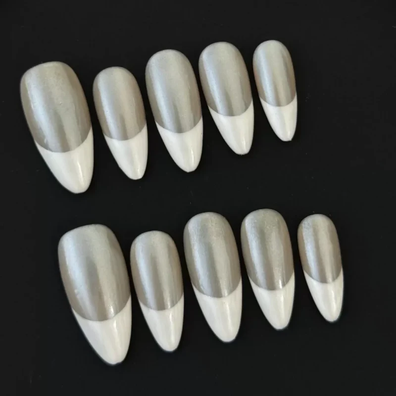 Shimmer Nude Press-On Nails with Pearl White French Tips on black background