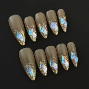 Side view of Iridescent French Press-On Nails with glossy nude base and glitter tips