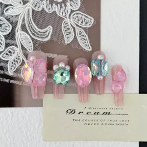 Side angle of blush pink press-on nails with crystal sparkle