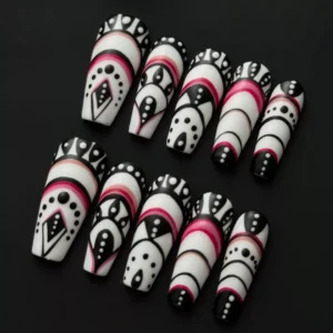 Side view of stiletto press-on nails with ethnic pattern and black, white, and red contrast