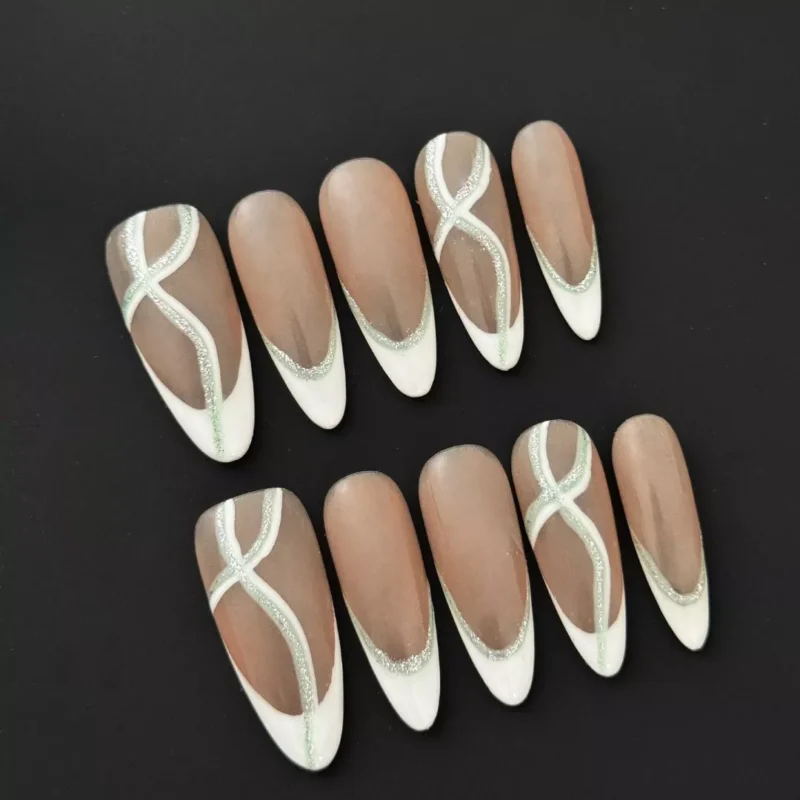 Silver Glitter French Press-On Nails with nude base and almond shape, showcasing elegant crossover tips