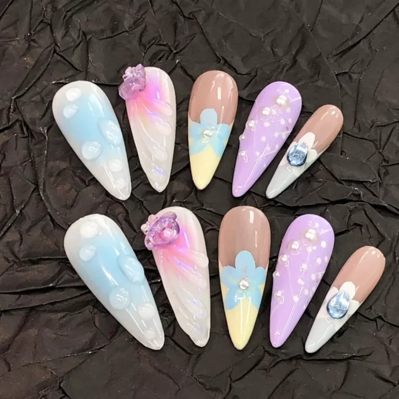 Spring Blossom Press-On Nails displayed on crinkled black paper