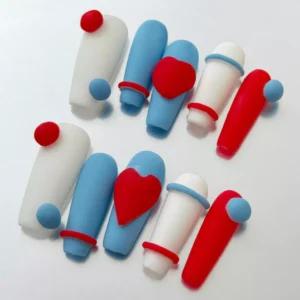 Side view of red white blue matte nails with square shape and comic art