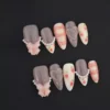 Strawberry Glitter Almond Press-On Nails featuring pink glitter gradient and pearl heart accents
