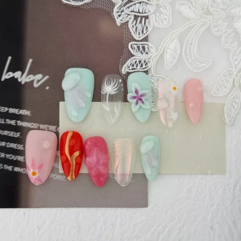 Summer fantasy press-on nails with colorful 3D carving and floral motifs