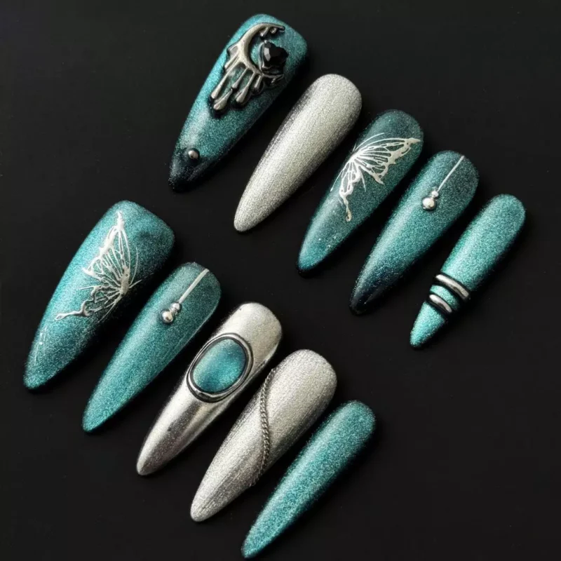 Teal glitter press-on nails with gothic butterfly and moon charm – full front set
