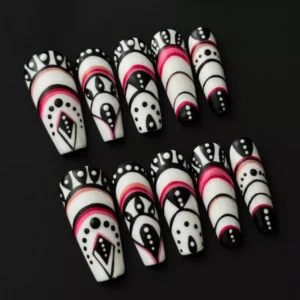Tribal geometric press-on nails in black, white, and red with bold abstract patterns – full set view