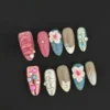 Tropical bloom press-on nails with 3D wave textures and crystal shell accents