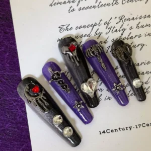 Close-up of vampire-style gothic press-on nails with crystal and blood-drip effects