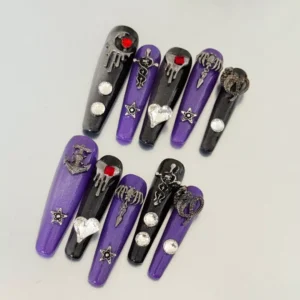 Gothic black and purple nails with star and snake metallic charms