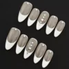 White French Press-On Nails with rhinestone accents and nude base – full hand view
