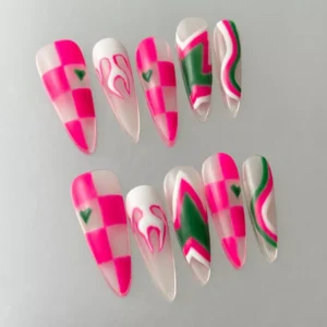 Close-up of hot pink swirl and checkerboard heart design on Y2K stiletto nails