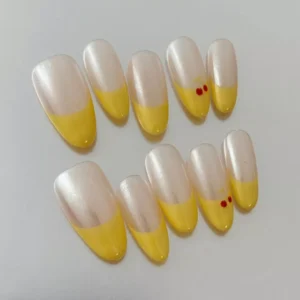 Yellow Tips Press-On Nails featuring chrome shine and cherry motifs - side angle