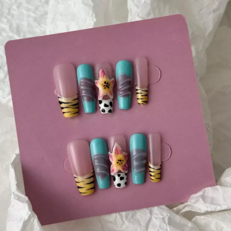 3D hibiscus charm and safari motif on tropical jungle press-on nails