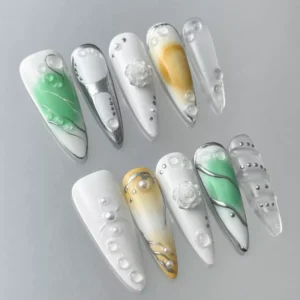3D rose accent nail with clear gradient and pearl sheen – close-up detail