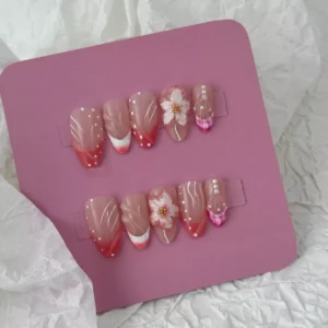 Backdrop shot of Romantic Flower Press-On Nails with mixed textures and glossy finish