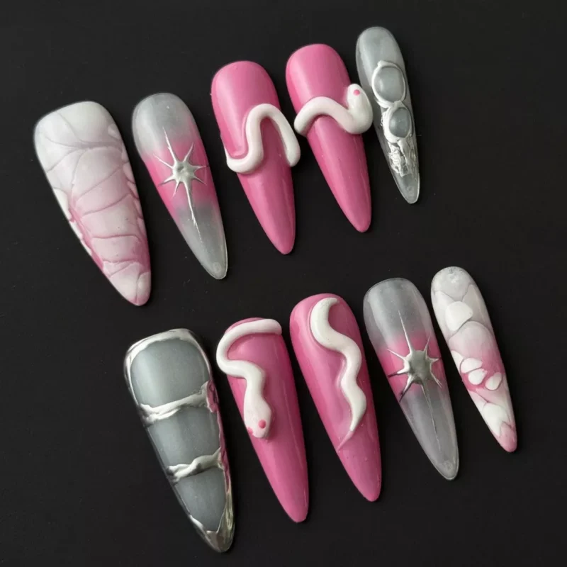 3D snake nail art on press-on nails with hot pink marble and star details