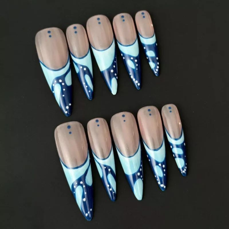 Abstract blue press-on nails with glossy finish and dotted French tip details