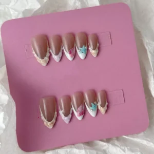 Artistic nude nails with sculptural seashell designs, pearls, and star embellishments