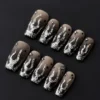 Black Silver Gradient Press-On Nails - Glitter Fire & Starry Charm Tips 4 Black silver gradient press-on nails with flame glitter and starry rhinestone accents – front view