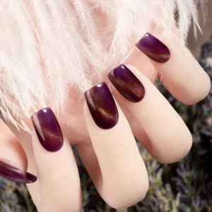 Burgundy magnetic cat eye gel polish on almond nails