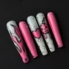Cartoon Pink Halloween Nails - Long Flames with Pumpkin and Heart 28 Cartoon pink Halloween nails with flame and heart designs – front view of glossy stiletto set