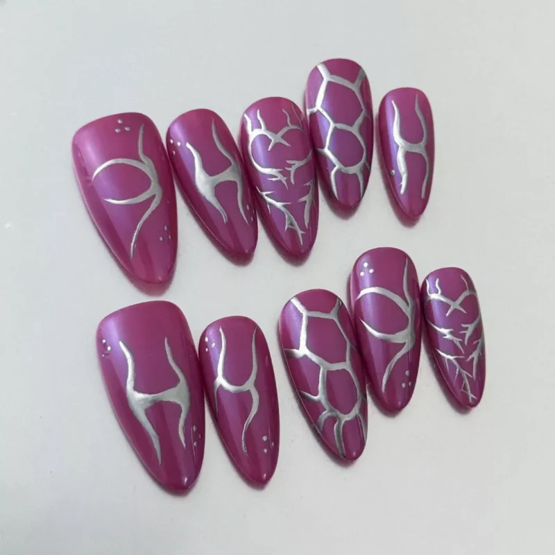 Chrome abstract press-on nails in purple with silver accents and cyber-style geometry – side view