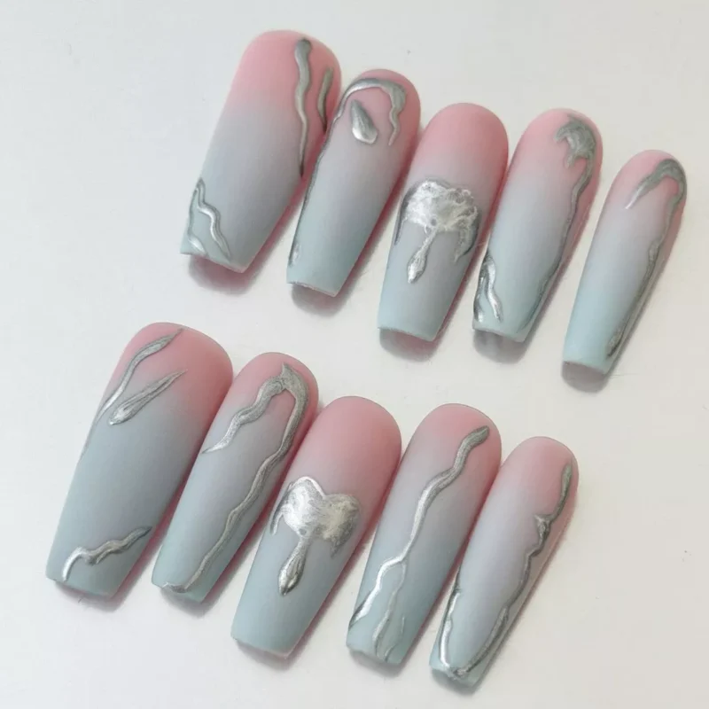 Close-up of metallic chrome lava line detail on gradient matte nails