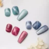 Cosmic Glow Cat Eye Gel Polish in teal, blue, and pink pastel magnetic shades