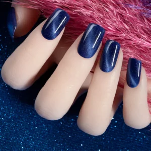 Navy blue magnetic cat eye nails on hand model