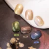 Crystal Prism Cat Eye Gel in earthy metallic tones: bronze, gold, and aurora blue