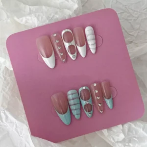 White and Blue Press-On Nails with gem accents in a glossy oval set – hand display view