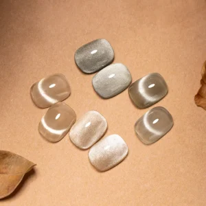 Collection of soft white cat eye nails with glossy and shimmer textures