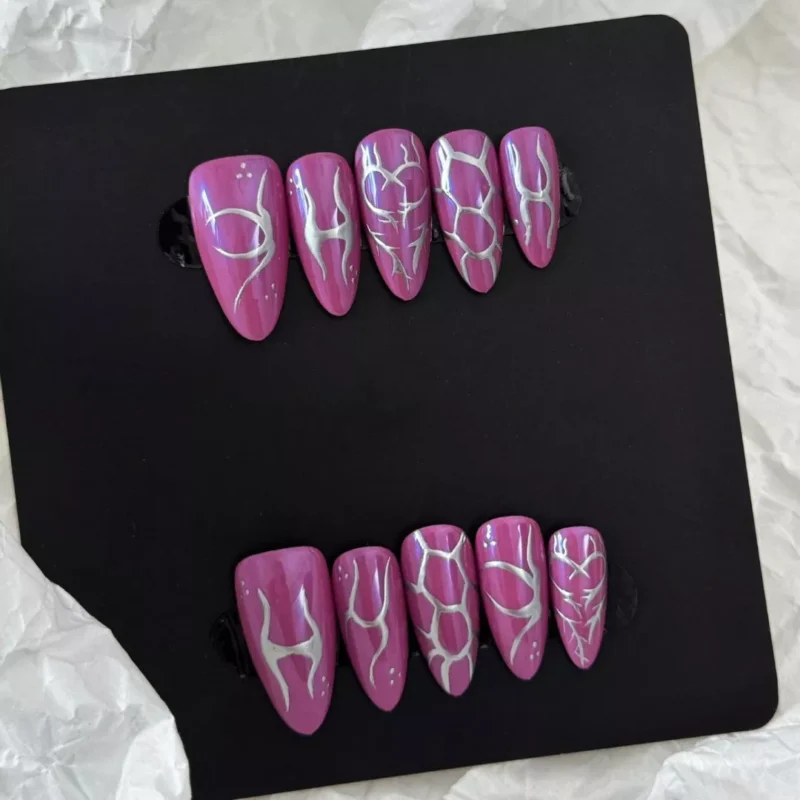 Long metallic purple press-on nails with minimalist silver striping and editorial vibe
