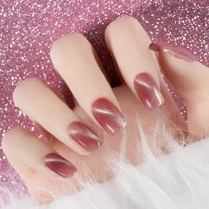 Pink glitter background with shimmering magnetic gel nails