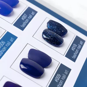 Detailed shot of dark blue and glitter swatches on display card