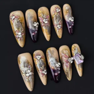 Side view of smoky marble press-on nails with gold flake and gem cluster art