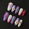 Iridescent 3D floral press-on nails with multicolor shimmer and pearl accents – angled view