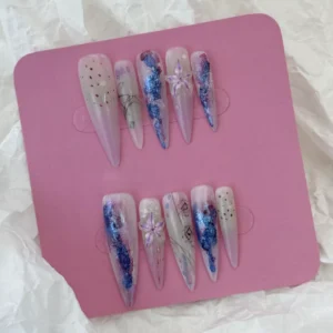 Mixed lighting on purple gradient glitter press-on nails with transparent floral tips