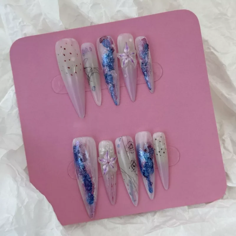Mixed lighting on purple gradient glitter press-on nails with transparent floral tips